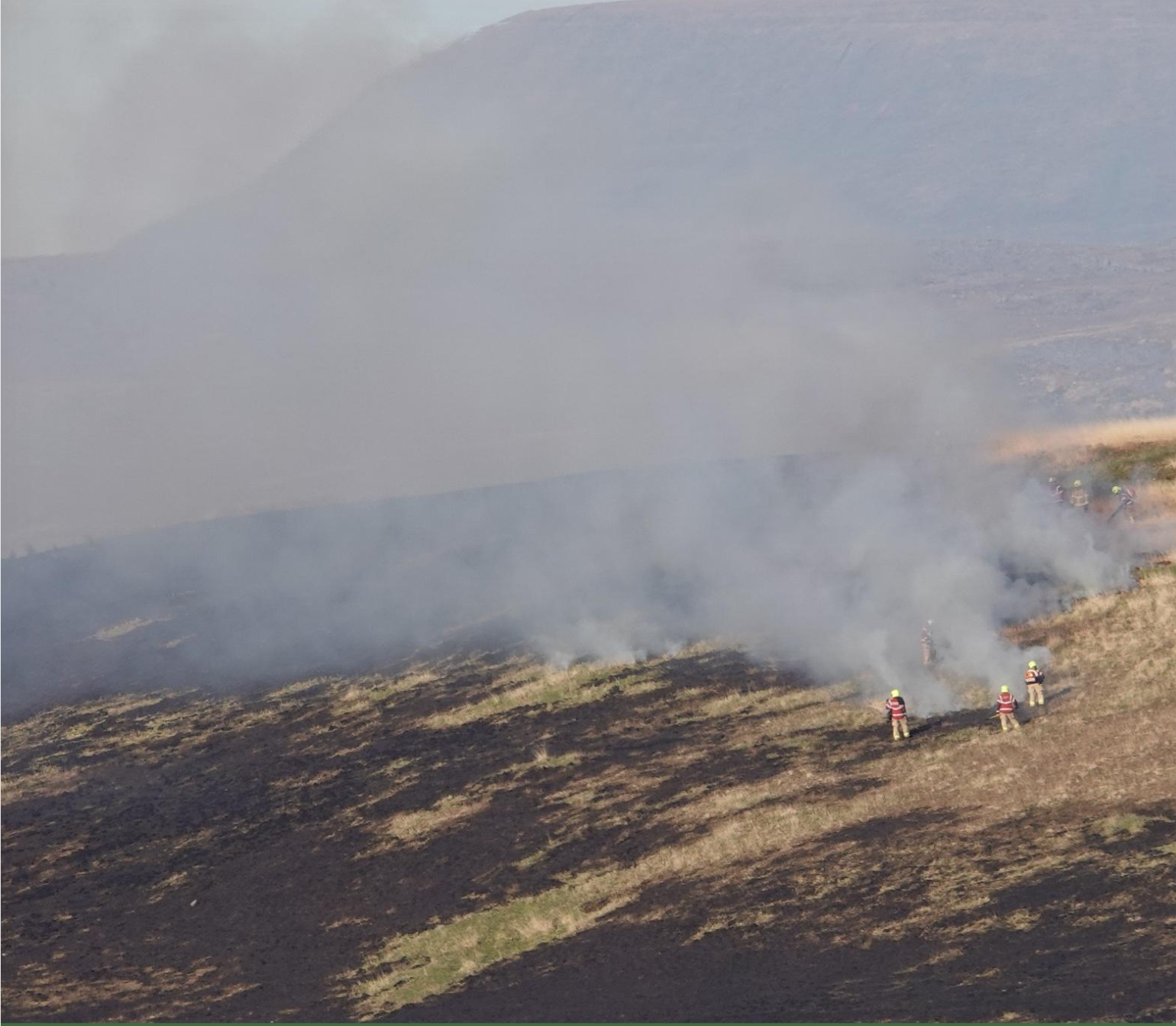 Firefighters battle a fire on a Welsh mountainside