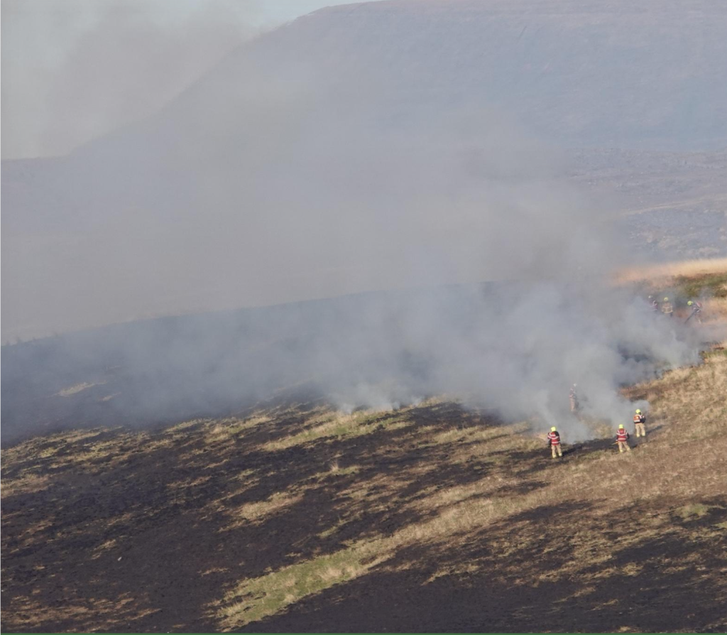 Firefighters battle a fire on a Welsh mountainside