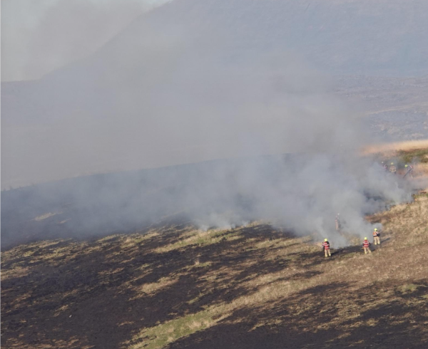 Firefighters battle a fire on a Welsh mountainside